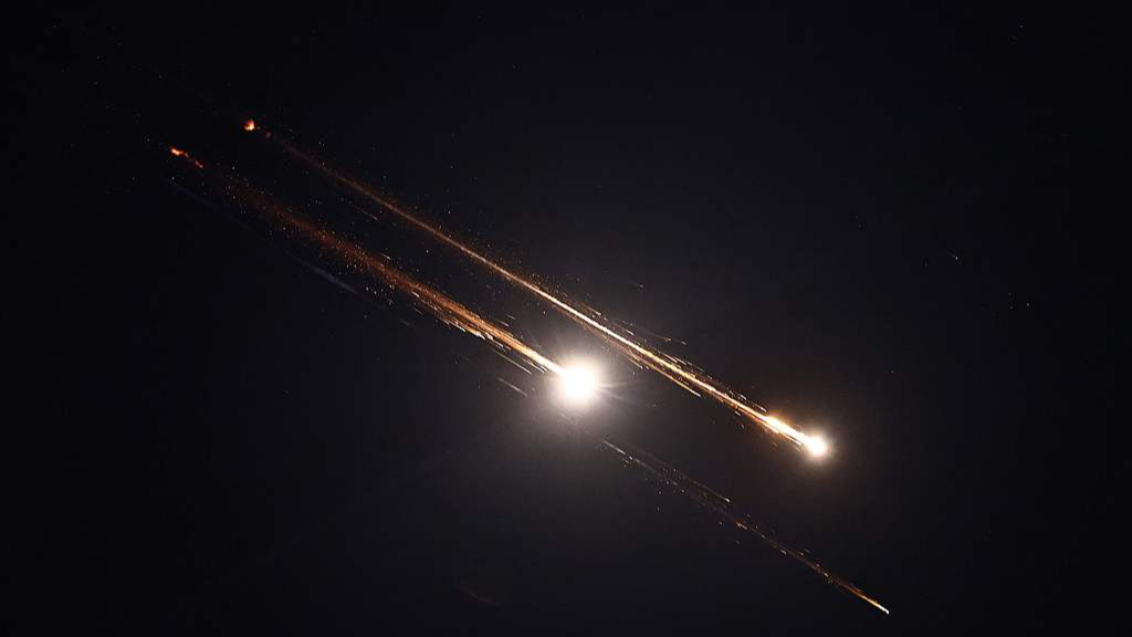 An Iranian rocket trails in the sky above Ramallah city in the West Bank on June 15, 2025. /VCG